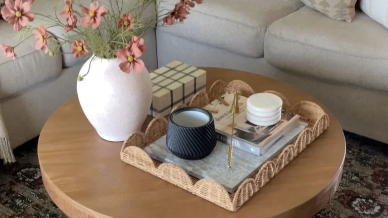 a round coffee table decorated with gift box and square tray