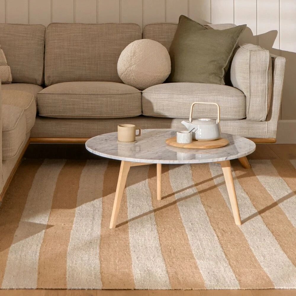 an oval coffee table with a tea set