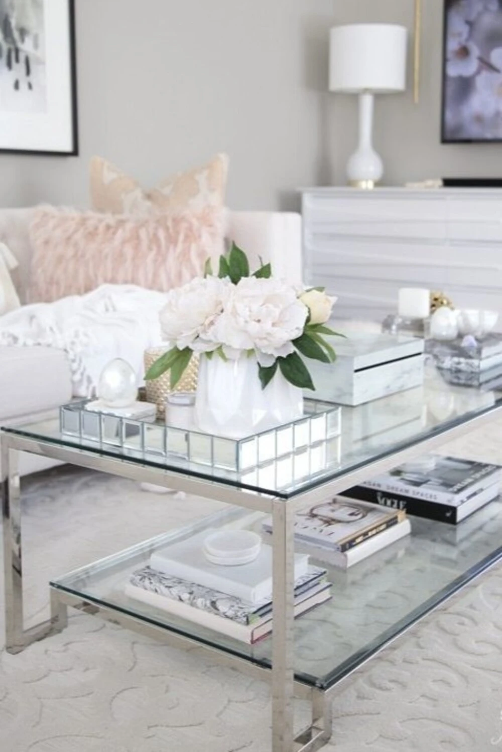 a rectangle glass coffee table with a bunch of white flower