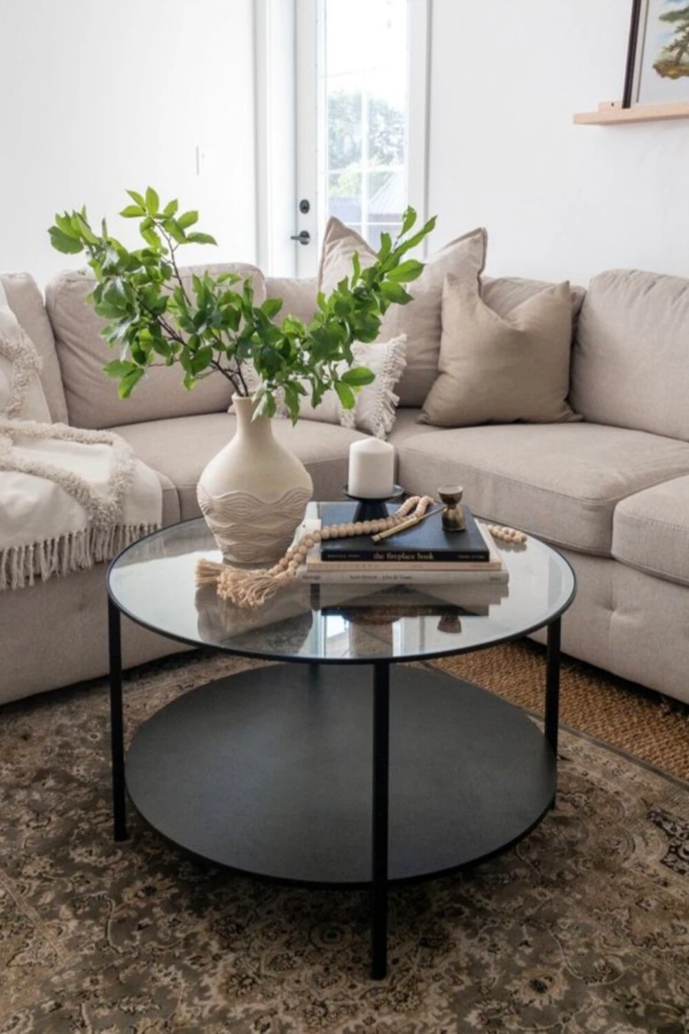 a glass coffee table with beadbone