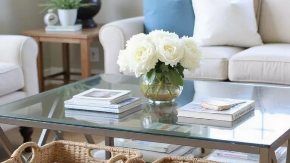 a rectangle glass coffee table decorated with storage box