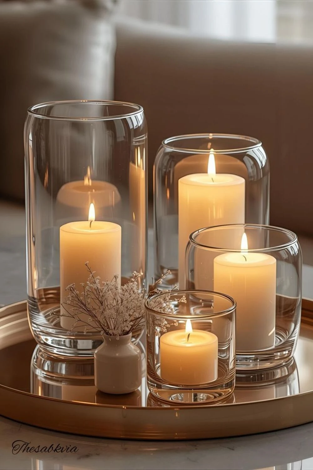 candles in glass on coffee table