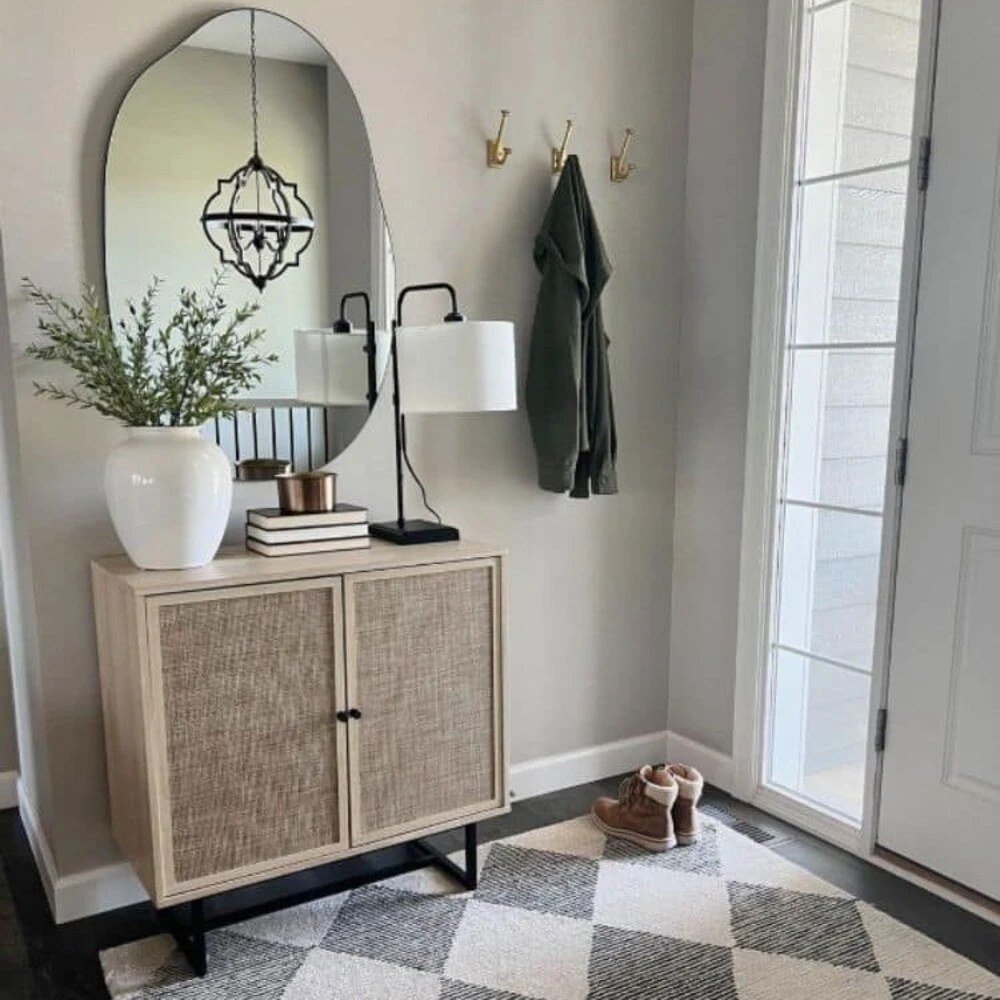 a small entryway with a closed cabinet
