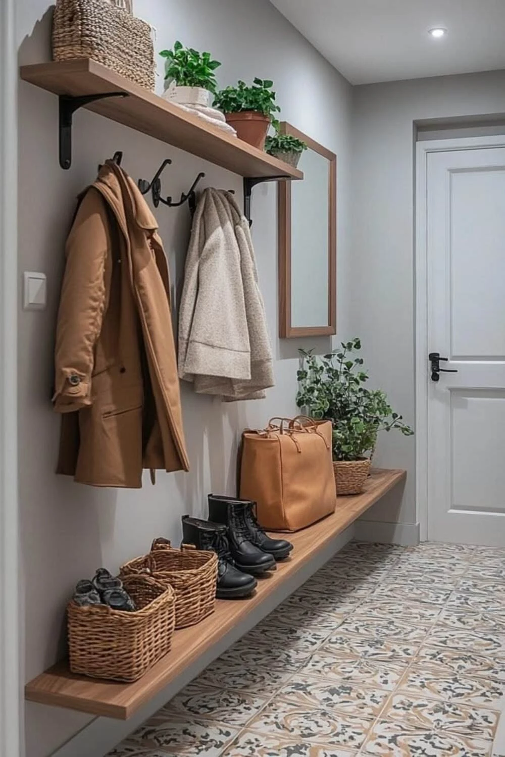 a small entryway with wall-mounted hooks