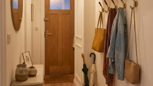 an apartment entryway with floating shelf