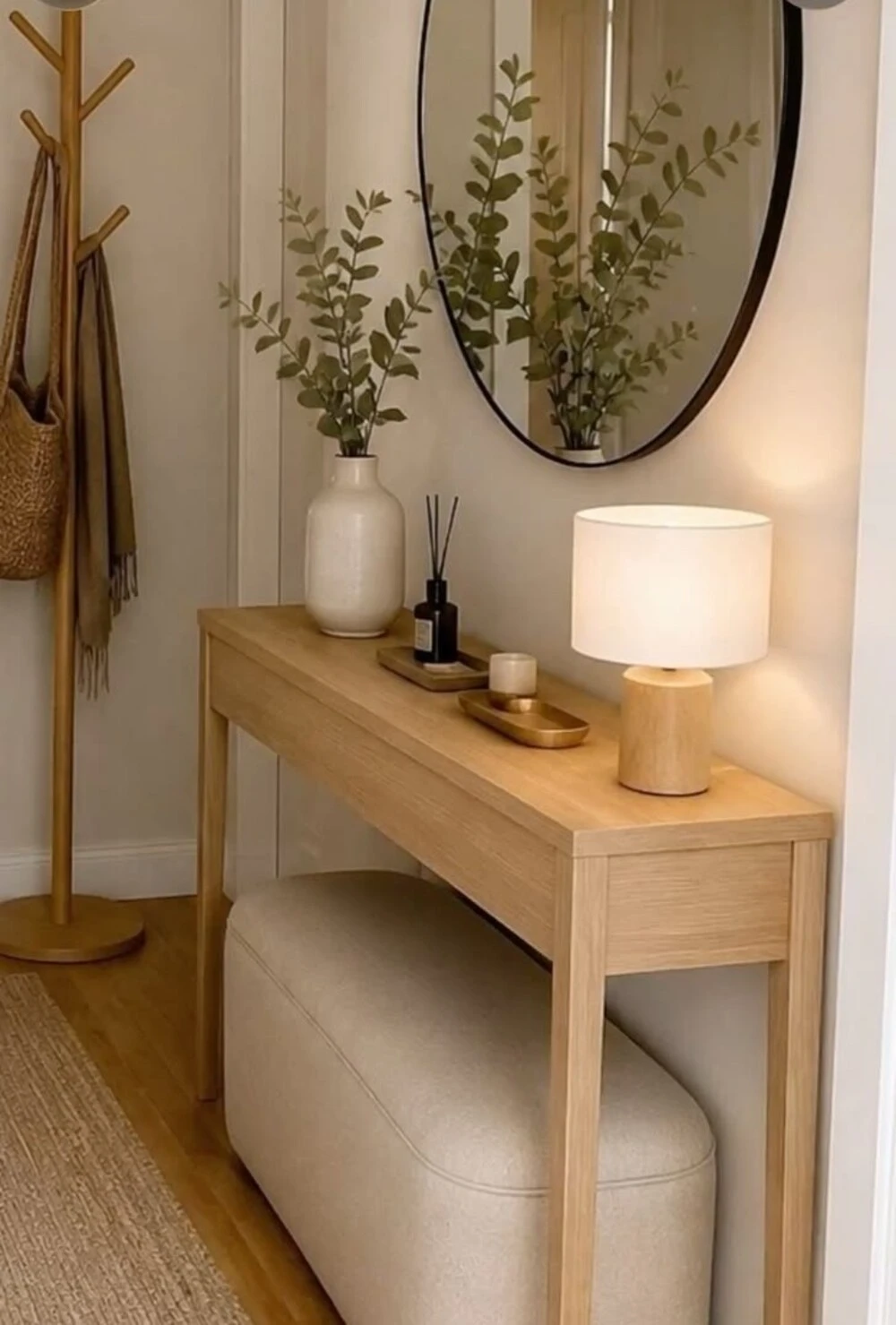 an apartment entryway with slim console table