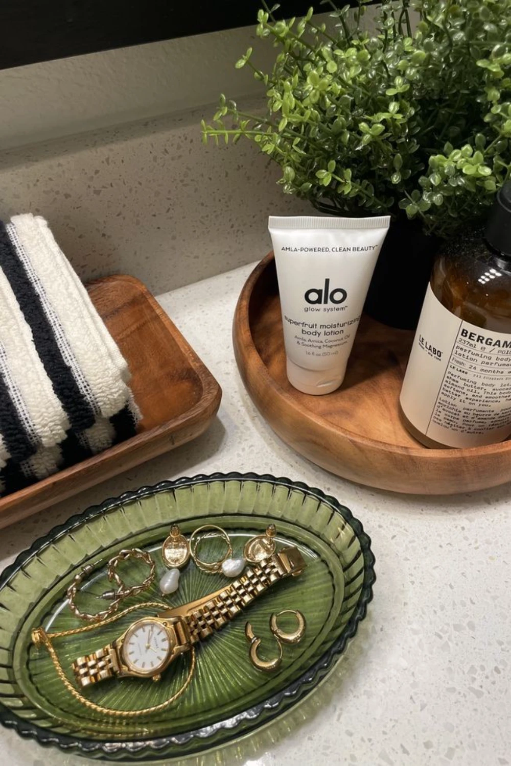 a bathroom with a jewelry tray