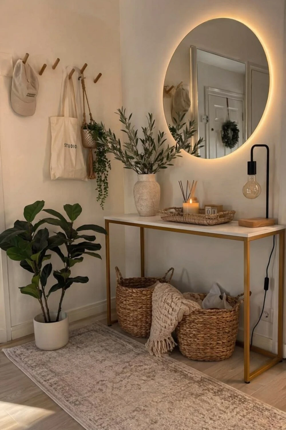 an entryway console table with potted plants and pothos