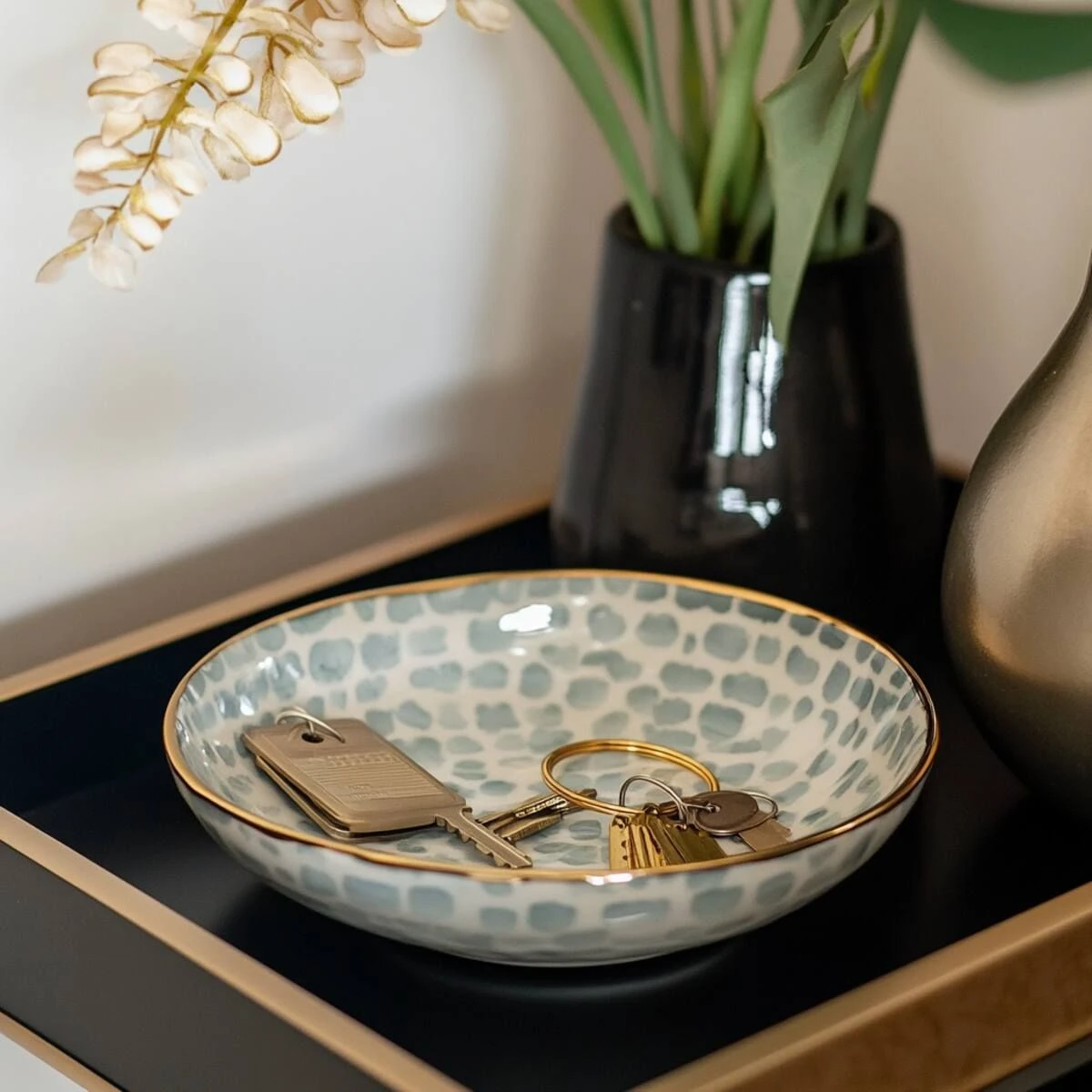 an entryway tray with bowl for keys