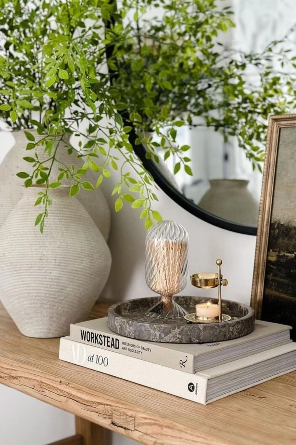 an entryway tray with metal accessories