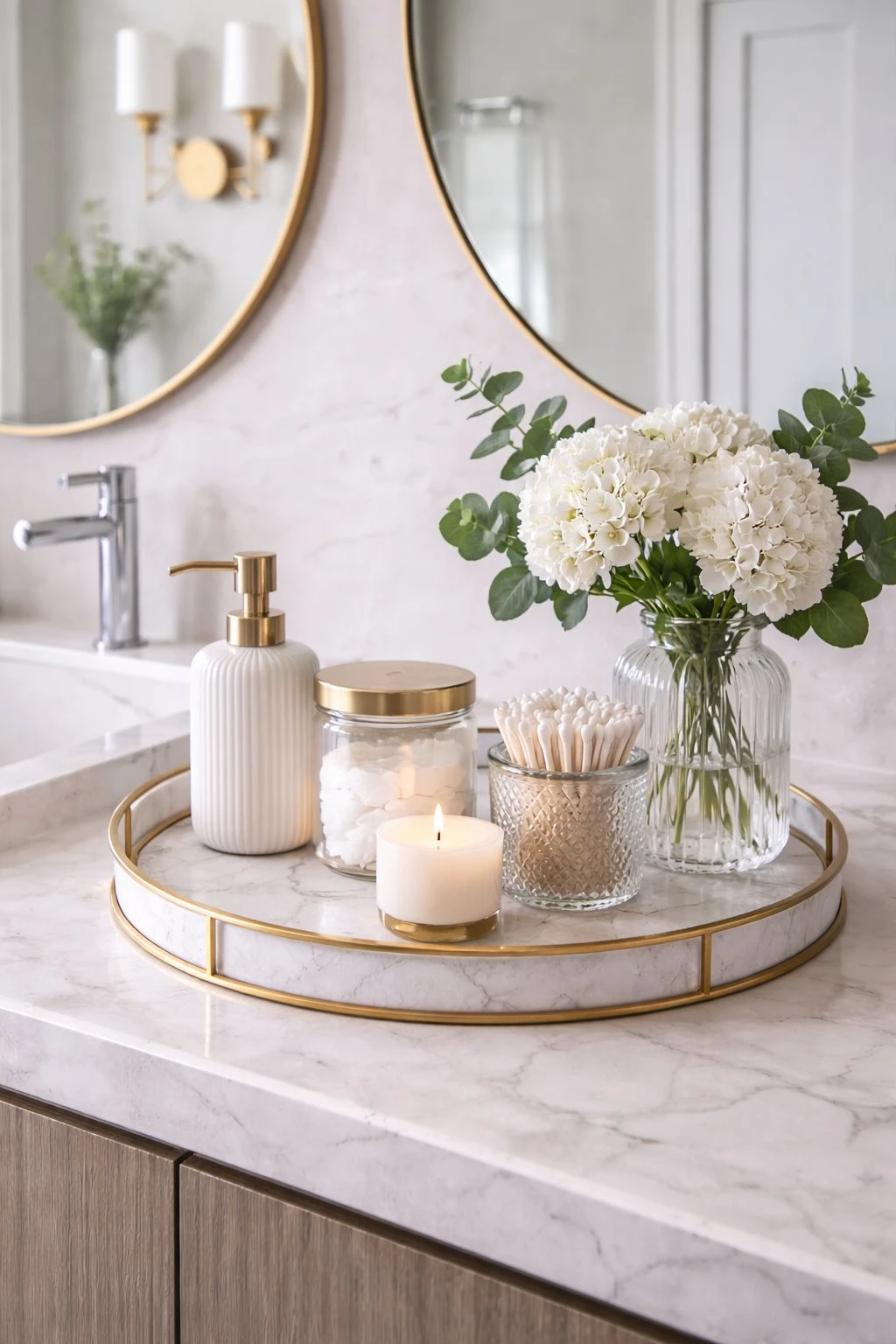 a bathroom with skincare products on a marble tray