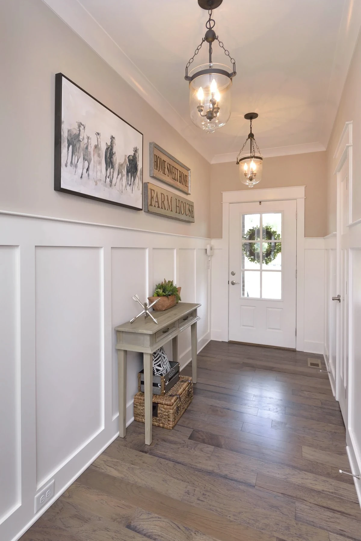 entryway wall with white wainscoting