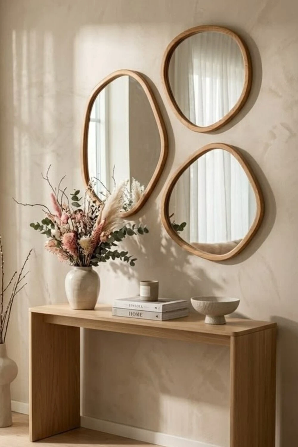 a small entryway with multiple mirrors
