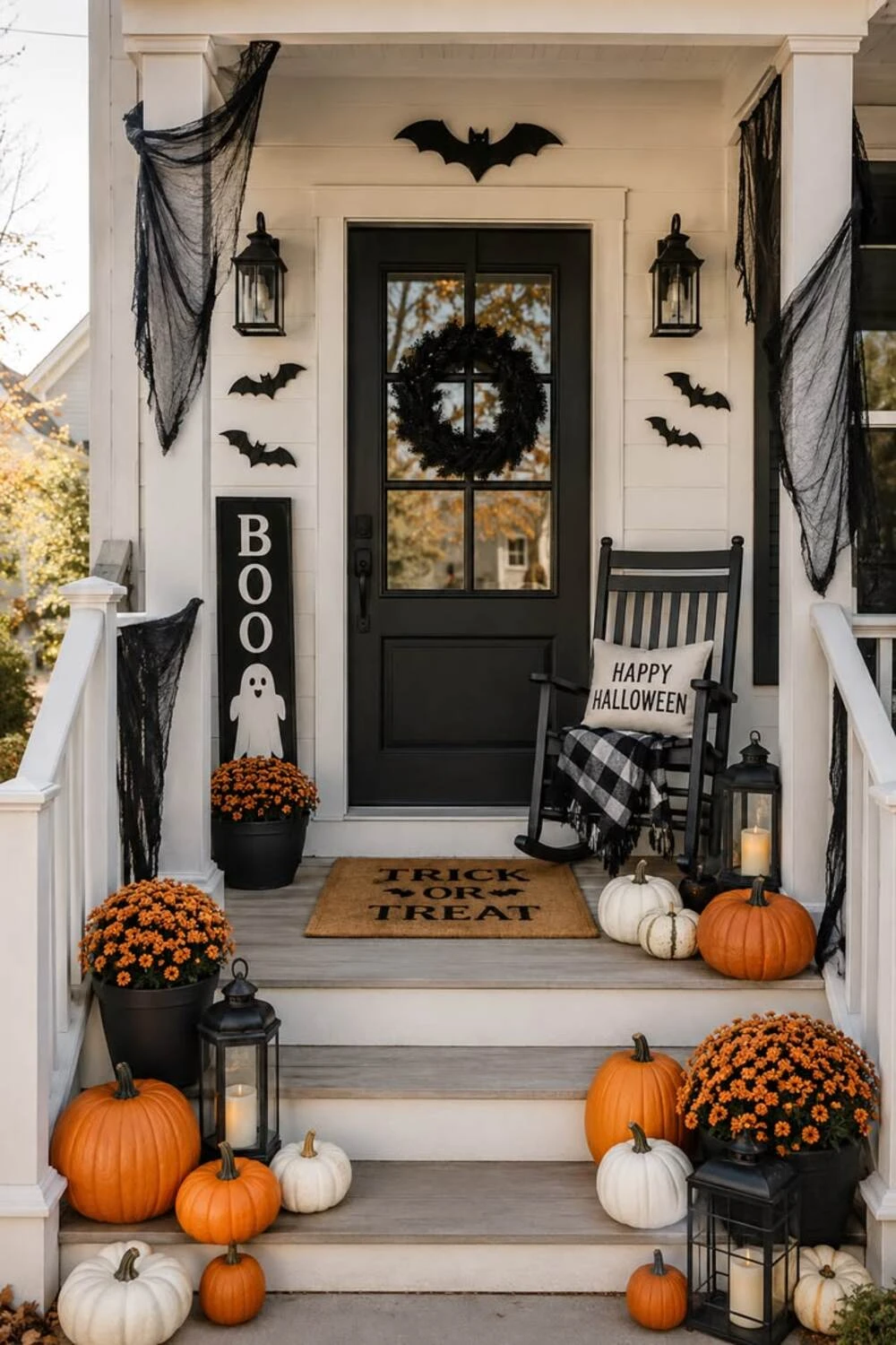 halloween front door with black wreath and bats